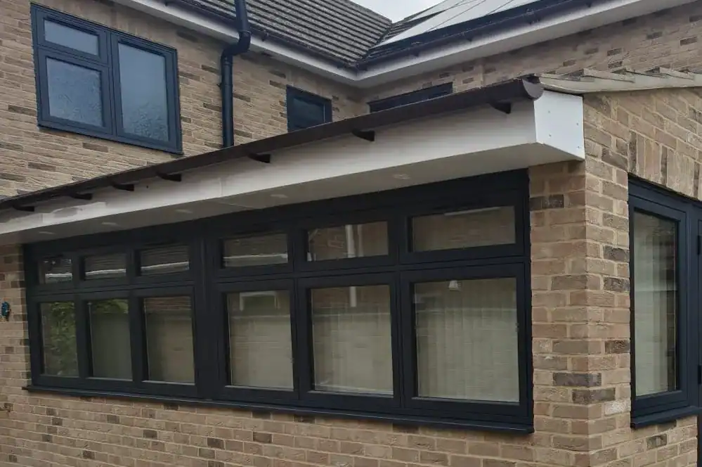 Anthracite aluminium windows in Ely installed across a brick home extension
