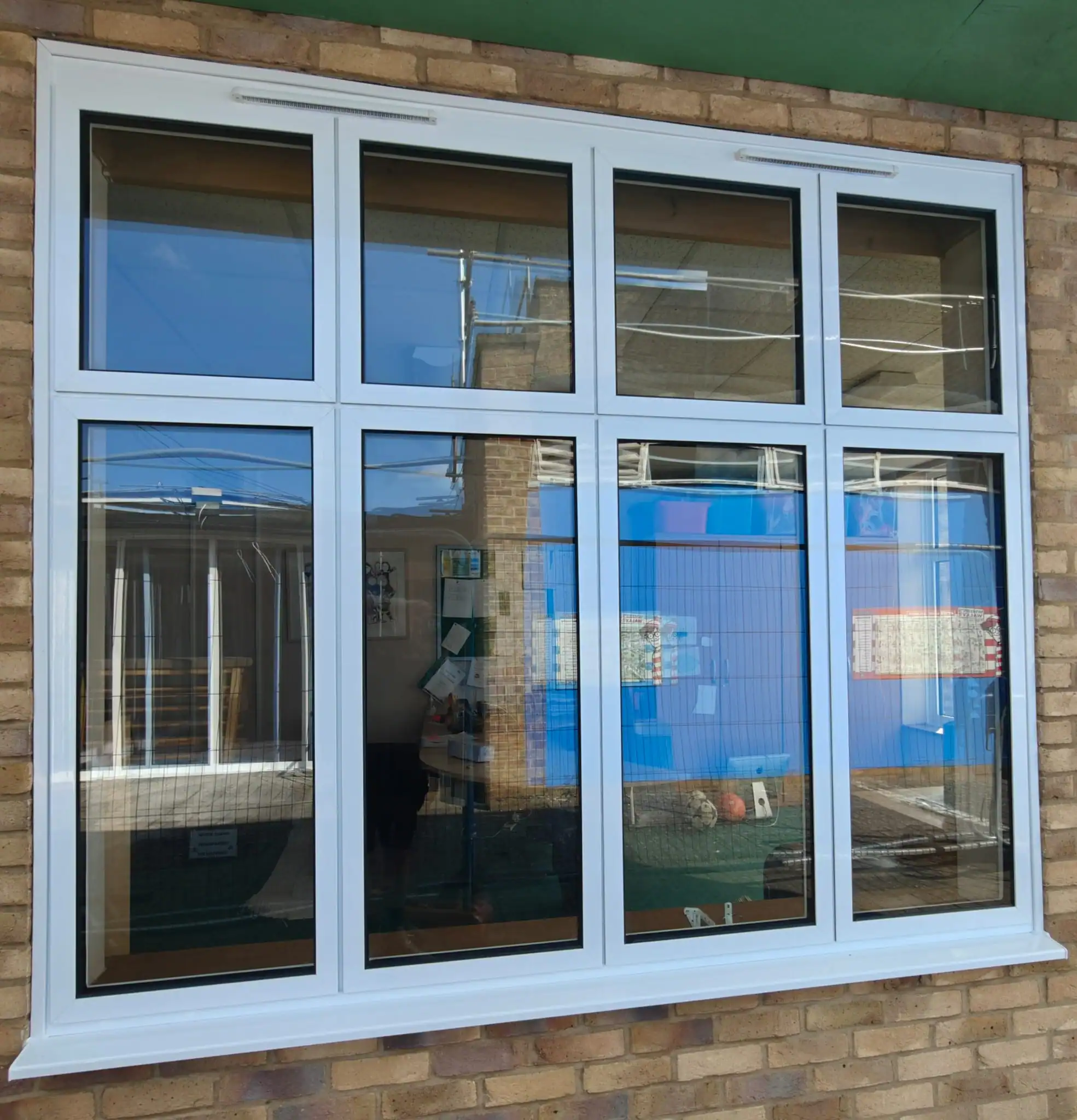 Double Glazing in Ely – large white-framed window with four smaller upper panes above four tall lower panes.